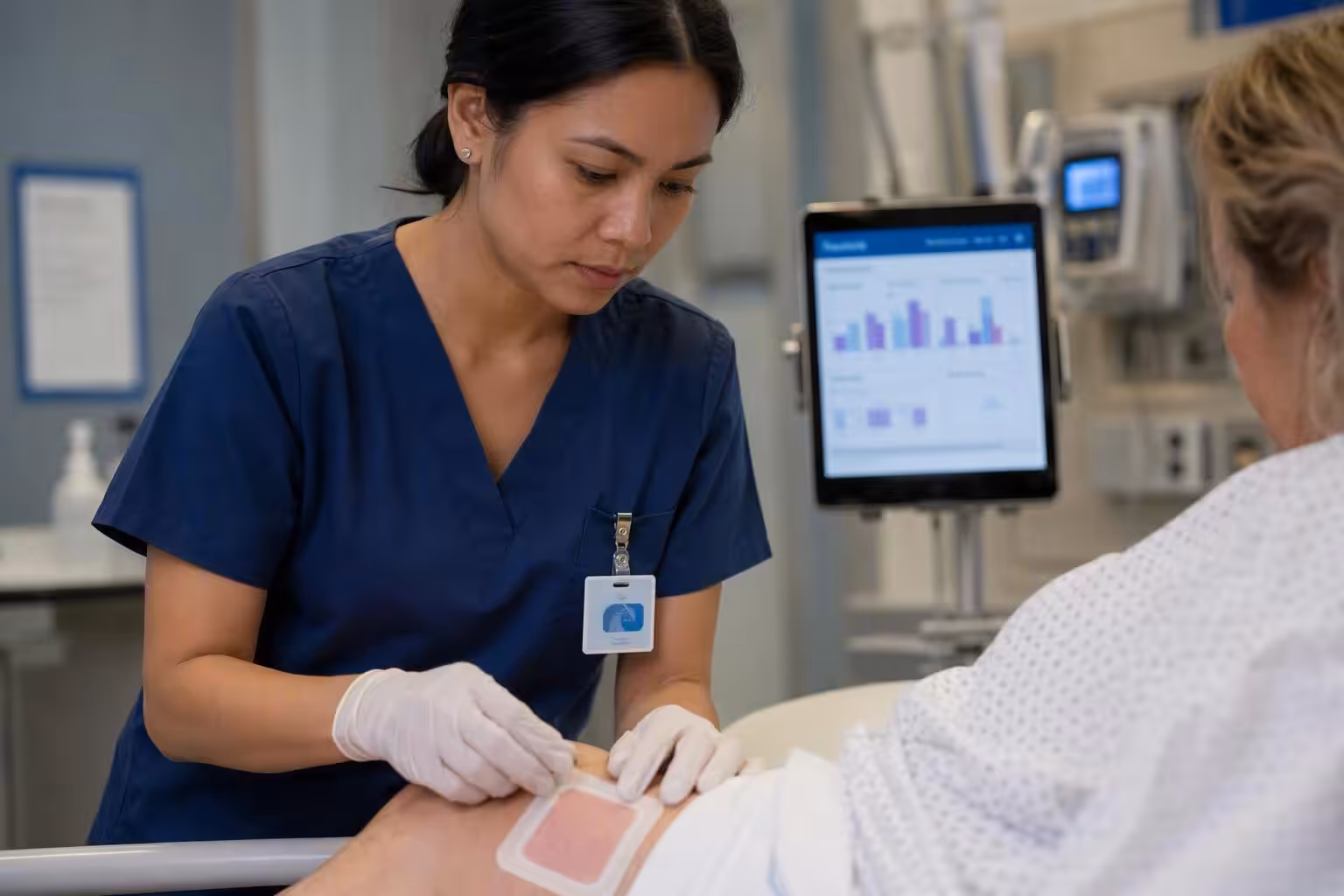 Clinical wound care professional evaluating silicone foam dressing quality in hospital setting